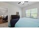 Comfortable bedroom featuring a large window, and a view into the adjacent living area at 6253 Catalina Dr. # 1711, North Myrtle Beach, SC 29582