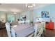 Open-concept dining area with hardwood floors, contemporary furniture, and a view into the living room at 6253 Catalina Dr. # 1711, North Myrtle Beach, SC 29582