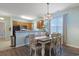 Cozy dining area featuring light blue walls, a wooden table, stylish chairs, and modern lighting at 6253 Catalina Dr. # 1711, North Myrtle Beach, SC 29582