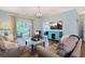 Cozy living room with light blue walls, sleek wood floors, comfortable couches and bright blue storage at 6253 Catalina Dr. # 1711, North Myrtle Beach, SC 29582