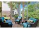 Relaxing screened-in patio with comfortable seating, lush greenery, and great natural light at 6253 Catalina Dr. # 1711, North Myrtle Beach, SC 29582