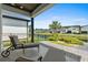 Relaxing back patio with lounge chairs and a view of the community pond and neighboring houses at 6706 Ocean Breeze Loop, Myrtle Beach, SC 29572