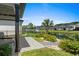Landscaped backyard features manicured lawn and water view with water feature for a relaxing outdoor space at 6706 Ocean Breeze Loop, Myrtle Beach, SC 29572