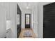 Hallway with black doors and light fixtures at 6706 Ocean Breeze Loop, Myrtle Beach, SC 29572