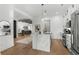 Open concept kitchen and living area with a large marble island with seating at 6706 Ocean Breeze Loop, Myrtle Beach, SC 29572