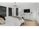 Spacious main bedroom boasts a marble-top dresser, large windows, and access to the ensuite bathroom at 6706 Ocean Breeze Loop, Myrtle Beach, SC 29572