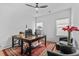 Bright home office with a modern desk, ample natural light, and a cozy seating area at 6706 Ocean Breeze Loop, Myrtle Beach, SC 29572