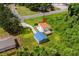 Aerial view of a home with orange roof and a detached shed with blue roof at 709 Highway 90, Conway, SC 29526
