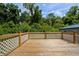 Spacious wooden deck perfect for outdoor entertaining or relaxing with lush greenery views at 709 Highway 90, Conway, SC 29526
