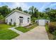 A contemporary home with a new outbuilding featuring lush landscaping, a well manicured yard, and modern design at 709 Highway 90, Conway, SC 29526