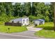 Modern home featuring a well-maintained lawn, an outbuilding and a stylish, minimalist design at 709 Highway 90, Conway, SC 29526