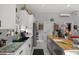 Bright kitchen featuring white cabinets, butcher block island, and modern stainless steel appliances at 709 Highway 90, Conway, SC 29526