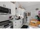 Stylish kitchen with white cabinetry, stainless steel appliances, and modern finishes at 709 Highway 90, Conway, SC 29526