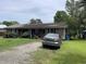 Brick home featuring a well-manicured lawn and mature trees at 719 11Th Ave. S, Myrtle Beach, SC 29577