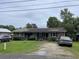 Brick duplex showcasing a well-kept lawn and inviting landscaping at 719 11Th Ave. S, Myrtle Beach, SC 29577