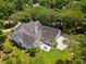 Aerial view of the home showcasing the backyard, patio, and surrounding greenery at 77 Capt Anthony White Ln., Georgetown, SC 29440
