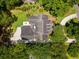 Aerial view of the property with lush trees, manicured lawns, and spacious driveway at 77 Capt Anthony White Ln., Georgetown, SC 29440