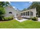 Picturesque backyard featuring a picnic table, lush landscaping, and a well-maintained lawn at 77 Capt Anthony White Ln., Georgetown, SC 29440