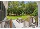 Inviting backyard space with a picnic table, mature trees, and lush green lawn at 77 Capt Anthony White Ln., Georgetown, SC 29440