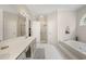 Bright and luxurious bathroom with a soaking tub, walk-in shower, and double vanity at 77 Capt Anthony White Ln., Georgetown, SC 29440