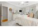 Bright bedroom with a plush bed, dresser, TV, and ceiling fan at 77 Capt Anthony White Ln., Georgetown, SC 29440
