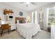 Cozy bedroom featuring a comfortable bed, desk and chair setup, and a decorative monogram at 77 Capt Anthony White Ln., Georgetown, SC 29440