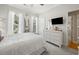 Comfortable bedroom features natural light, dresser, and a TV for relaxed viewing at 77 Capt Anthony White Ln., Georgetown, SC 29440