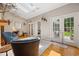 Versatile bonus room with natural light, hardwood floors, and a view to the backyard at 77 Capt Anthony White Ln., Georgetown, SC 29440