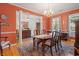 Elegant dining room featuring wood floors, wainscoting, and a chandelier above a large table at 77 Capt Anthony White Ln., Georgetown, SC 29440