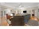 Bright living room with a fireplace, hardwood floors, and comfortable seating, perfect for relaxation at 77 Capt Anthony White Ln., Georgetown, SC 29440