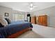 Comfortable bedroom features a large bed, neutral decor, and large windows at 77 Capt Anthony White Ln., Georgetown, SC 29440