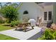 Charming patio with a picnic table, barbecue grill, and access to the home at 77 Capt Anthony White Ln., Georgetown, SC 29440