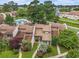 Aerial view of property showcasing lush landscaping, community pool, and well-maintained exteriors at 800 Egret Circle # 53, Little River, SC 29566