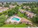 Aerial view highlighting community pool and sun-deck with adjacent townhome buildings at 800 Egret Circle # 53, Little River, SC 29566