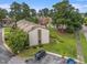 Aerial view of community showcasing building exteriors, green space, pool and proximity to parking at 800 Egret Circle # 53, Little River, SC 29566