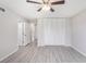 A bright bedroom featuring an ensuite bathroom, closet, neutral walls, and modern flooring at 800 Egret Circle # 53, Little River, SC 29566