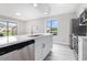 Updated kitchen features stainless steel appliances, white cabinets, and quartz countertops at 800 Egret Circle # 53, Little River, SC 29566