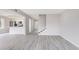 Open-concept living area with gray flooring and a staircase leading up to the second floor at 800 Egret Circle # 53, Little River, SC 29566