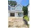 Charming two-story home with light blue siding and an attached open garage at 804 Nw Palm Frond Way # 804, Calabash, NC 28467