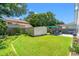 Well-maintained backyard featuring a shed, lush green grass, and a patio at 867 Cardinal Pl., North Myrtle Beach, SC 29582