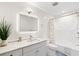 Updated bathroom featuring a modern vanity, decorative tile, and a shower-tub combination, offering a functional design at 867 Cardinal Pl., North Myrtle Beach, SC 29582