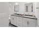 Modern bathroom featuring double sinks, updated vanities, and sleek fixtures, offering a functional and stylish space at 867 Cardinal Pl., North Myrtle Beach, SC 29582