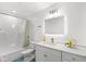 Bright bathroom featuring a modern vanity, decorative tile, and a shower-tub combination, offering a functional design at 867 Cardinal Pl., North Myrtle Beach, SC 29582