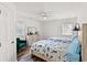 Inviting bedroom featuring two twin beds, a ceiling fan, and ample natural light, perfect for relaxation and rest at 867 Cardinal Pl., North Myrtle Beach, SC 29582