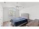 Cozy bedroom featuring vaulted ceilings, a large window, and stylish furniture, creating a relaxing retreat at 867 Cardinal Pl., North Myrtle Beach, SC 29582