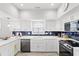 Bright, remodeled kitchen with white cabinets, subway tile backsplash, and stainless steel appliances at 867 Cardinal Pl., North Myrtle Beach, SC 29582