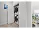 Convenient laundry area features stacked washer and dryer with storage at 867 Cardinal Pl., North Myrtle Beach, SC 29582