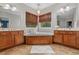 Bright bathroom with a soaking tub, double vanity sinks and natural light at 100 Brookgreen Trace Pl., Pawleys Island, SC 29585