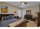 Comfortable bedroom features neutral walls, dark furnishings, and a plush bed at 100 Brookgreen Trace Pl., Pawleys Island, SC 29585