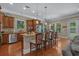 Spacious kitchen with stainless steel appliances, granite countertops, and breakfast bar at 100 Brookgreen Trace Pl., Pawleys Island, SC 29585